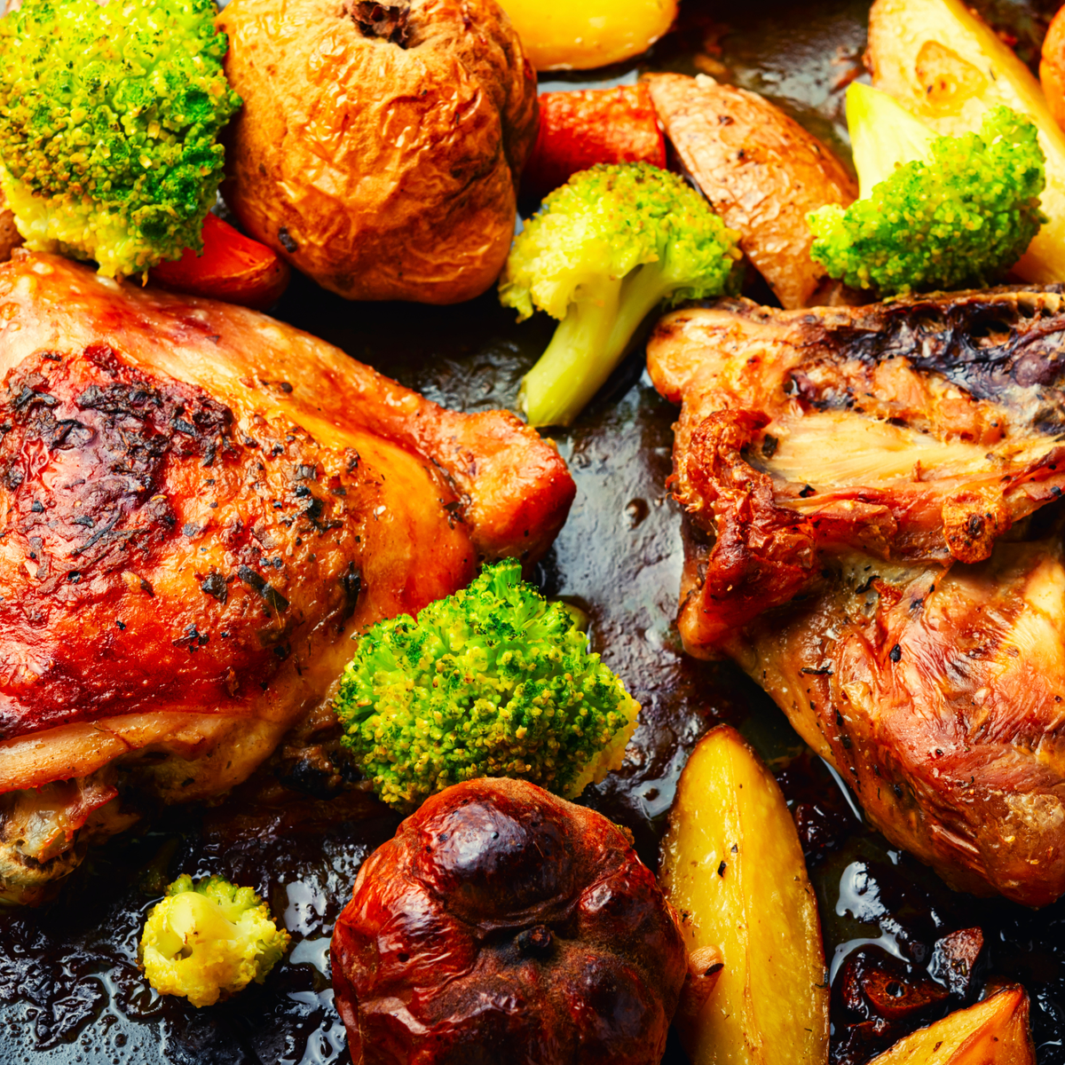 Chicken thighs with apples and onions in a skillet
