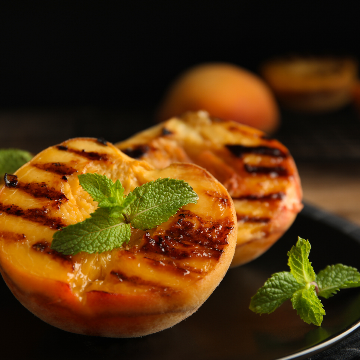 Grilled peach halves with caramelized brown sugar and warm spices
